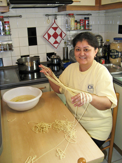 Housekeeper Hurshida making noodles