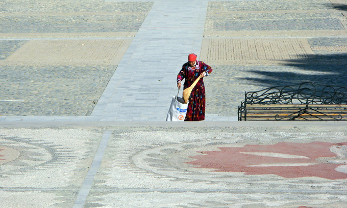 Woman sweeping and cleaning